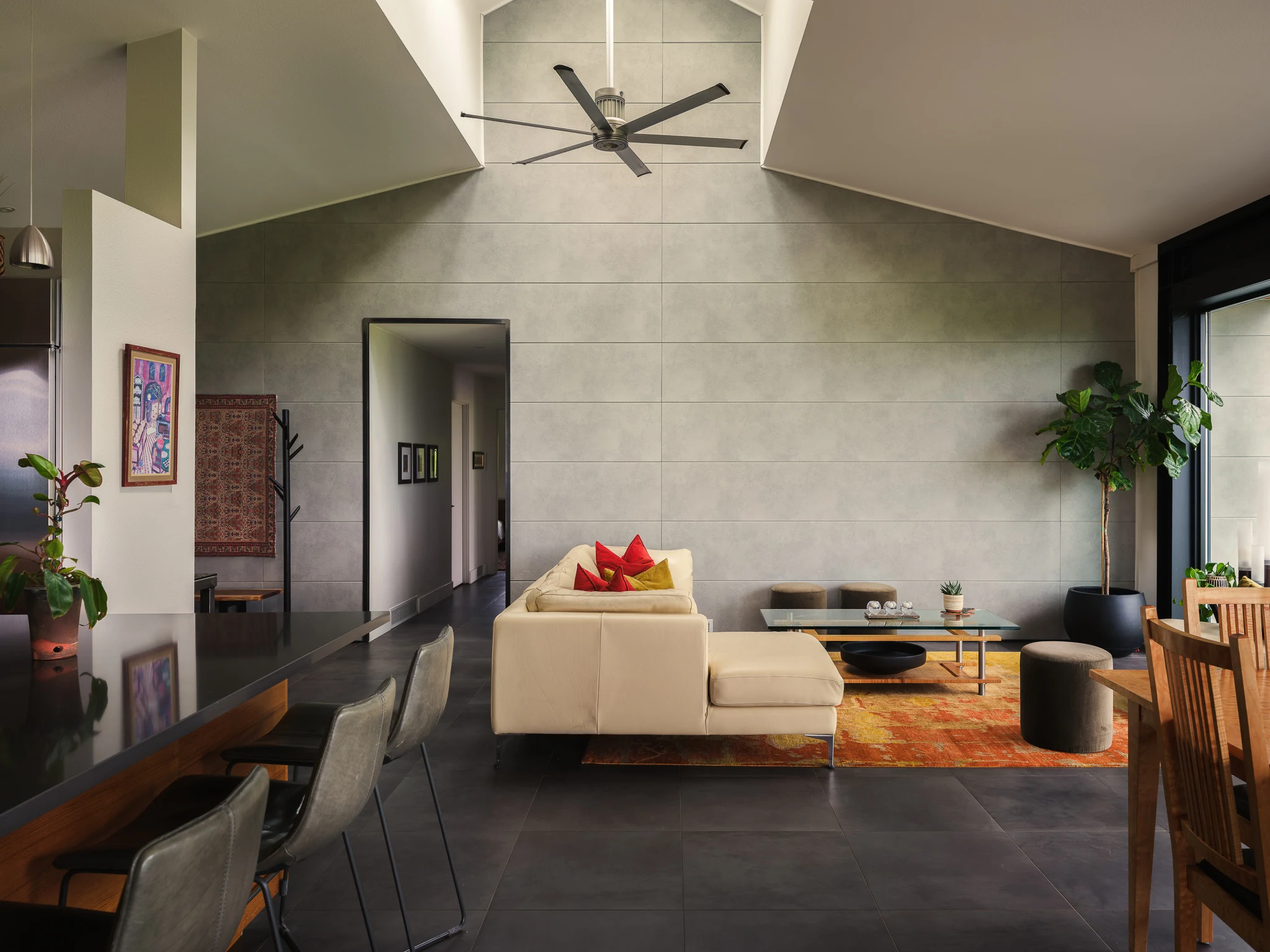 Open great room with vaulted ceiling, kitchen, and dining beyond — interior design photography Bozeman Montana, Living Places Design Studio